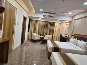 Postel nebo postele na pokoji v ubytování Hotel Grace Galaxy