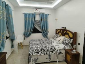 Postel nebo postele na pokoji v ubytování Britis Guest House in Lomé