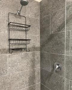 a bathroom with a shower with a shower head at Bacchus Marsh Caravan Park in Bacchus Marsh