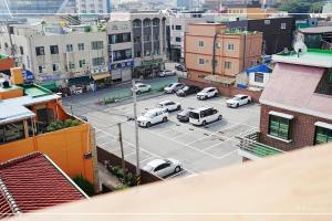 an aerial view of a parking lot in a city at Gaho Guesthouse in Mokpo