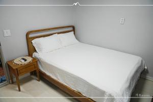Ένα ή περισσότερα κρεβάτια σε δωμάτιο στο Gaho Guesthouse +28 φωτογραφίες