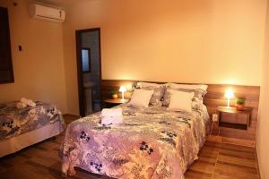 Postel nebo postele na pokoji v ubytování Pantanal Ranch Meia Lua