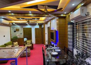 A television and/or entertainment centre at Heart of Rajshahi Hub-Appt C