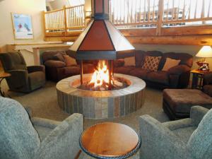 a fire place in the middle of a living room at Legacy Vacation Resorts Steamboat Springs Hilltop in Steamboat Springs