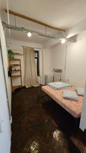 a room with two beds in a room with water on the floor at Victoriei54YOU in Bucharest