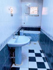 a bathroom with a sink and a toilet at Osiris Hotel Luxor in Luxor