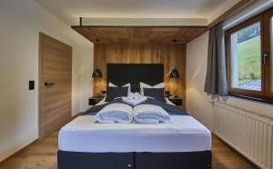 Łóżko lub łóżka w pokoju w obiekcie Chalet Wallehen