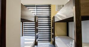 Postel nebo postele na pokoji v ubytování The Pad CoLiving