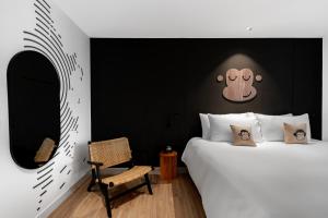 Voodi või voodid majutusasutuse Blu Monkey Hub and Hotel Laguna, Bangtao Phuket toas