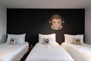 Voodi või voodid majutusasutuse Blu Monkey Hub and Hotel Laguna, Bangtao Phuket toas