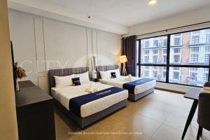 Giường trong phòng chung tại Mossaz City Haven Kuala Lumpur +53 ảnh