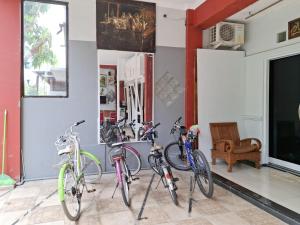 a group of bikes parked in a room at Alam Citra BnB Mitra RedDoorz in Yogyakarta