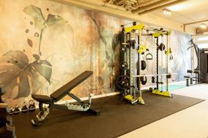 a room with a gym with a wall with plants at Wellnesshotel Sanct Bernhard in Bad Ditzenbach