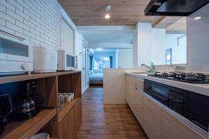 a kitchen with a stove and a counter top at Zabo Hills 205 in Sapporo +104 photos