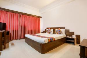 Ліжко або ліжка в номері FabHotel Darshan Tower