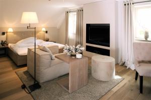 Letto o letti in una camera di Bad Bubendorf Design & Lifestyle Hotel