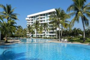 a large swimming pool in front of a hotel at Super Condo 1 en Vidanta in Nuevo Vallarta