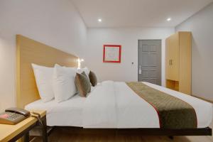 Postel nebo postele na pokoji v ubytování Hotel New City Lite