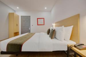 Postel nebo postele na pokoji v ubytování Hotel New City Lite