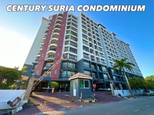 a large apartment building in front of a street at Century Suria Seaview + 3 Bedroom Apartment in Kuah