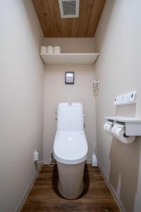 a bathroom with a white toilet in a room at Zabo Hills 303 in Sapporo