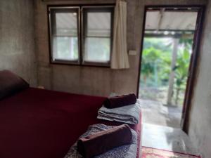 Postel nebo postele na pokoji v ubytování Mountain Jungalows, Koh Chang