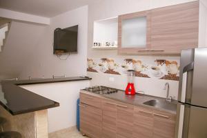 Kuchyň nebo kuchyňský kout v ubytování Condominio Tolima