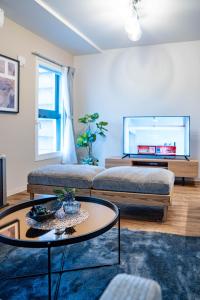 a living room with a couch and a table at Zabo Hills 305 in Sapporo
