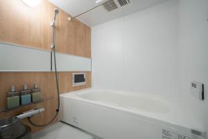 a bathroom with a bath tub in a room at Zabo Hills 305 in Sapporo +129 photos