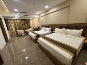 Postel nebo postele na pokoji v ubytování Hotel Grace Galaxy