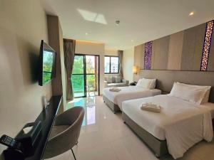 TV a/nebo společenská místnost v ubytování THE TJ HOTEL Pattaya