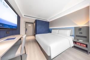 Postel nebo postele na pokoji v ubytování Atour Light Hotel Kunming Dongfeng Plaza Beijing Road