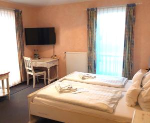 Postel nebo postele na pokoji v ubytování Hotel Villa Weststrand