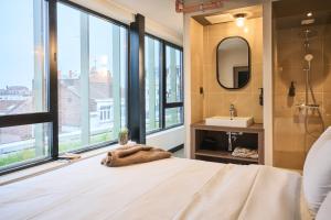 Postel nebo postele na pokoji v ubytování JOST Hôtel Lille Centre
