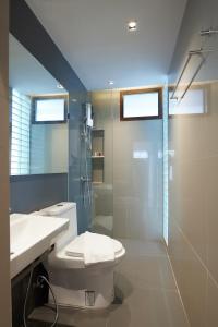 a bathroom with a toilet and a shower and a sink at ROOMS at Number60 Khaosan Bangkok in Bangkok +74 photos