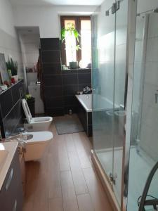 a bathroom with a shower and a toilet and a sink at Yoda house in Legnica