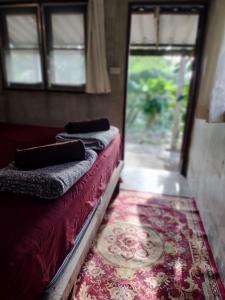 Postel nebo postele na pokoji v ubytování Mountain Jungalows, Koh Chang
