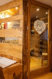 a wooden room with a rooster on the wall at Maison Villair - Courmayeur in Courmayeur