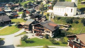an aerial view of a town with a church at Haus Marlene in Schoppernau