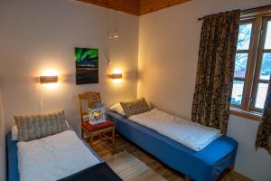 Postel nebo postele na pokoji v ubytování Sortland Camping og Motell AS