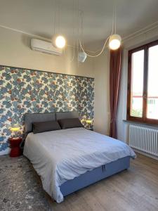 Ένα ή περισσότερα κρεβάτια σε δωμάτιο στο LE COLLINE HOUSE San Miniato