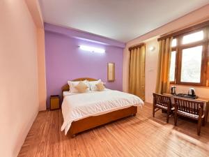 Postel nebo postele na pokoji v ubytování Hotel Geetanjali