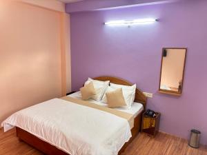 Postel nebo postele na pokoji v ubytování Hotel Geetanjali