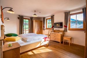 Postel nebo postele na pokoji v ubytování Residence Mitterdorfer