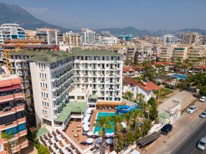 an aerial view of a city with a large building at Sun Fire Beach Hotel - All Inclusive in Alanya