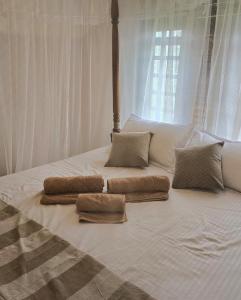 Letto o letti in una camera di Ginger Harmony Guesthouse and Cafe