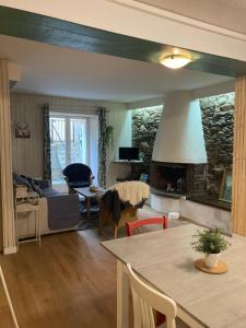 a living room with a couch and a table at T2 58m2 Allée des Bains-Tarifs cure in Luchon