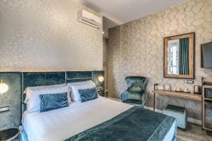 Postel nebo postele na pokoji v ubytování Apollo Boutique Hotel