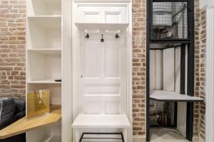 a room with a white door and shelves at Royal mini apart-hotel on Kovzhyna in Lviv +120 photos