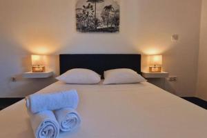 Postel nebo postele na pokoji v ubytování Appt Perle de Corail face au lagon de St-Leu